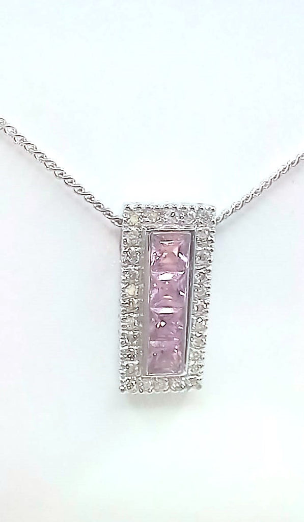 18 ct White Gold Sapphire and Diamond pendant on a 9 ct chain