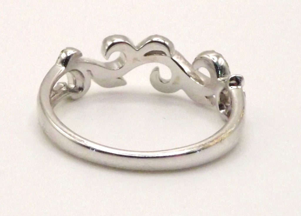 9 ct White Gold swirl design ring with diamonds