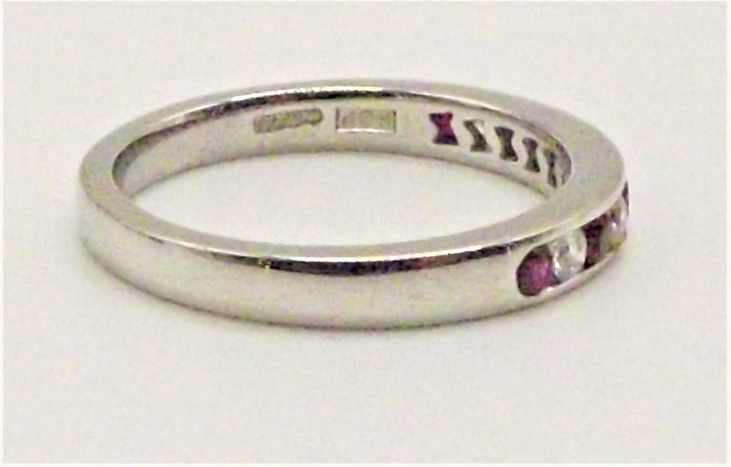 Platinum half eternity ring with rubies and diamonds