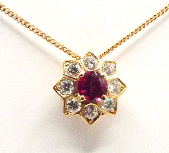 18ct Rose Gold Pendant set with a 0.3ct Ruby surrounded by Brilliant Cut Diamonds