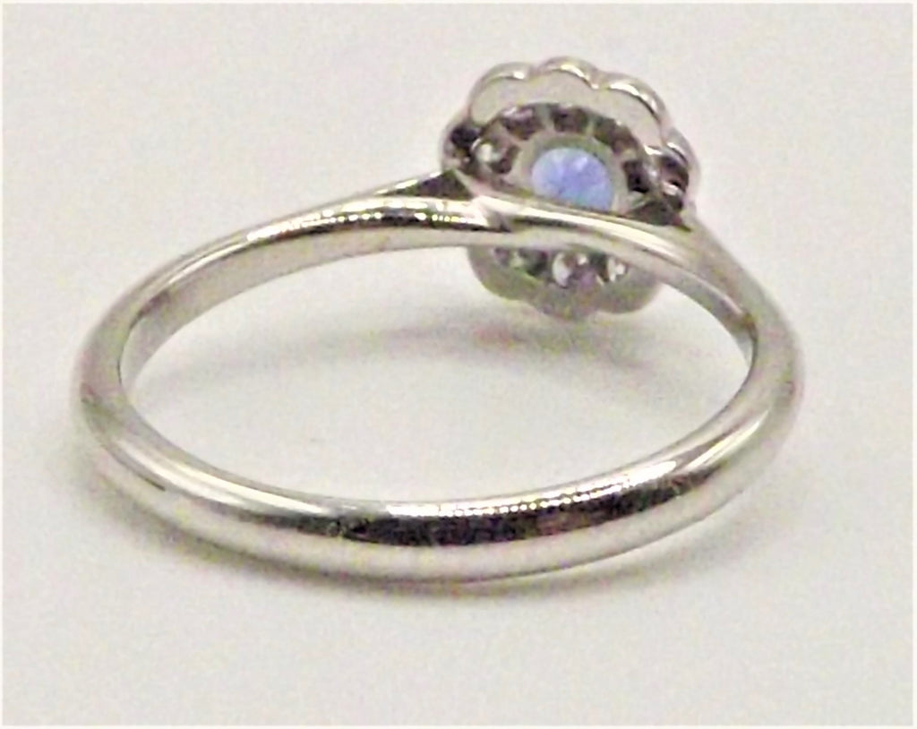 Platinum ring with flower set 0.51 ct Sapphire with Diamonds